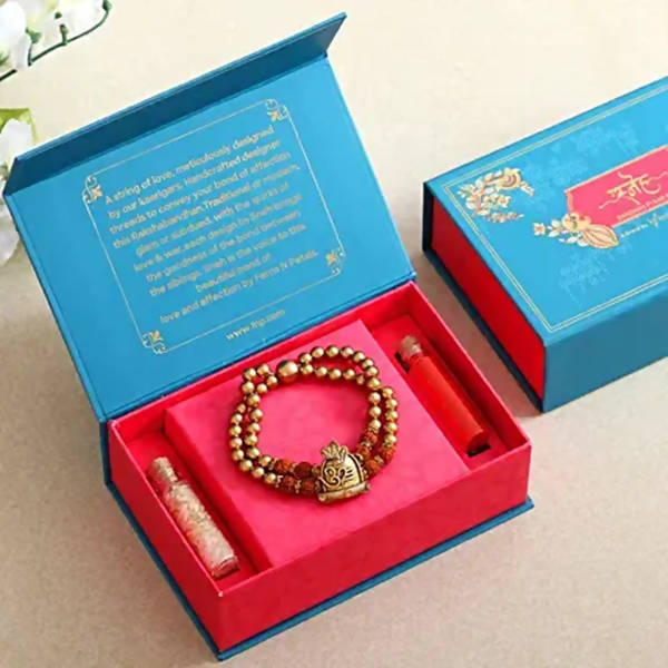 Om Pearl Bracelet Rakhi & Fruit N Nut Chocolates - Distacart