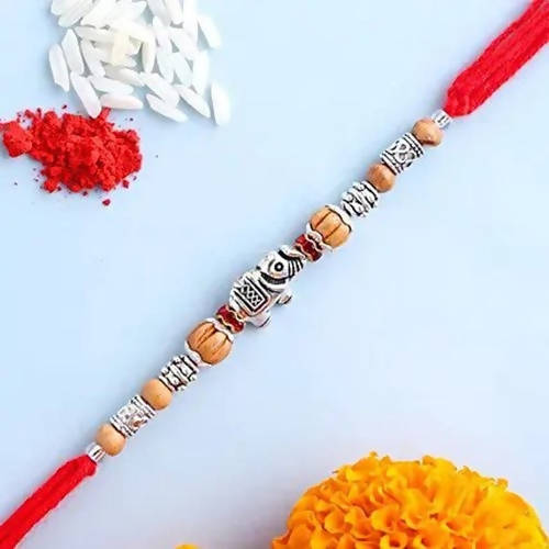 Feng Shui Rakhi With Besan Laddoo & Cashew Jar online