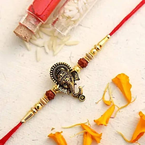Lord Ganesha Rudraksha Rakhi & Kaju Roll Box - Distacart