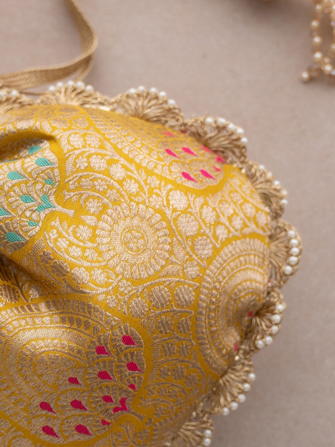 Amyra Ethnic Motif Woven Design Banarasi Silk Potli bag - Distacart
