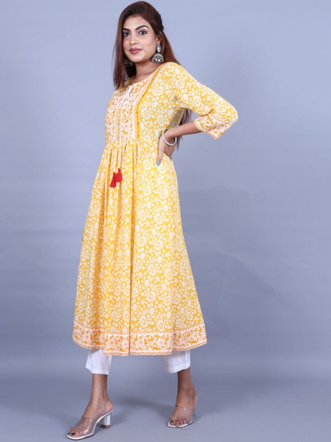 HERE&NOW Women Yellow Floral Printed Sequined A-Line Kurta with Trousers - Distacart