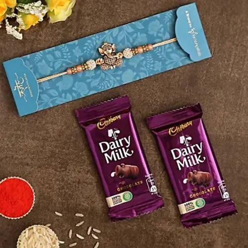 Enticing Ganesha Rakhi & Dairy Milk Chocolate