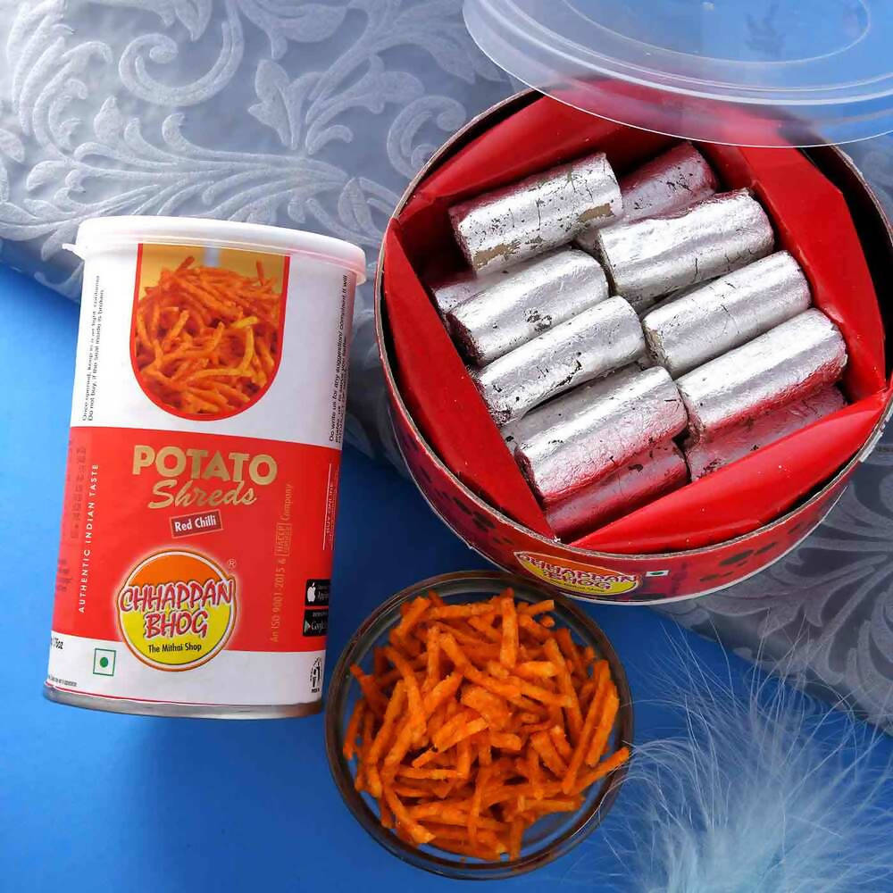 2 Divine Om Rakhis & Pista Kaju Roll Box Hamper
