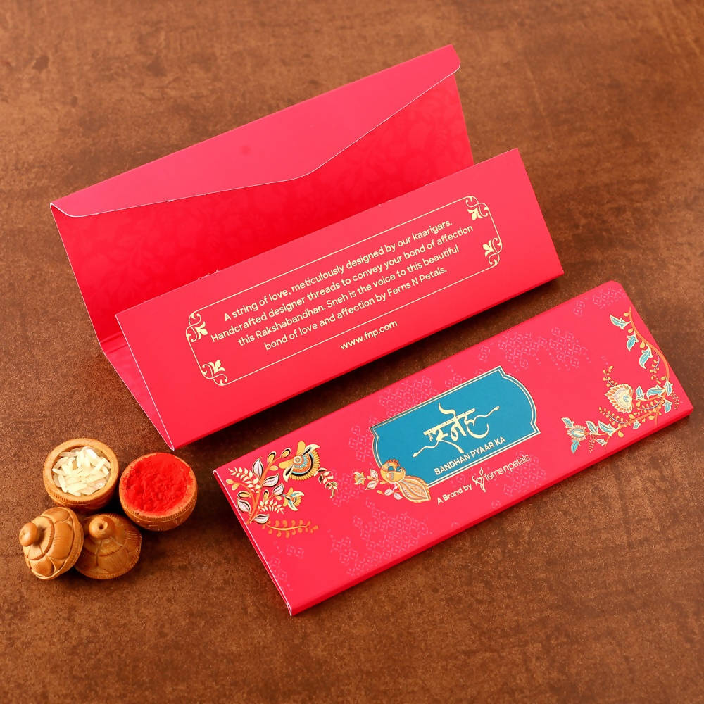 Cute Ganesha Rakhi & Kaju Rolls Box Online