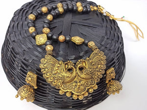 Terracotta Long Necklace Set With Peacock Pendant With Temple Jhumkas-Black And Gold